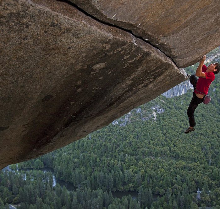 Alex Honnold making a rope-less ascent of the famous Seperate Reality, a difficult over hanging hand rack that is perched 500ft. above the Valley floor.  This route has only been done rope-less three other times.