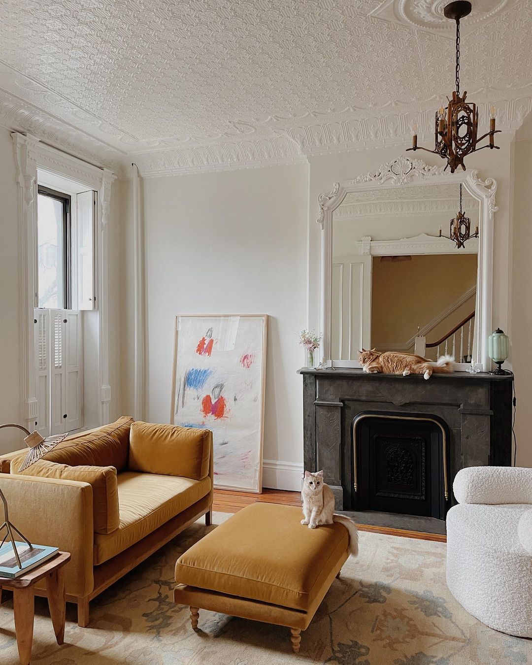 Décor Inspiration: A Bright & Airy Brooklyn Apartment with Gilded Mirrors and a Pink Mario Bellini Sofa