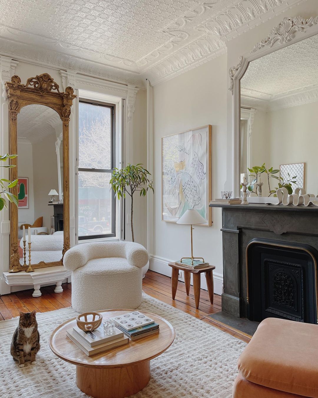 Décor Inspiration: A Bright & Airy Brooklyn Apartment with Gilded Mirrors and a Pink Mario Bellini Sofa