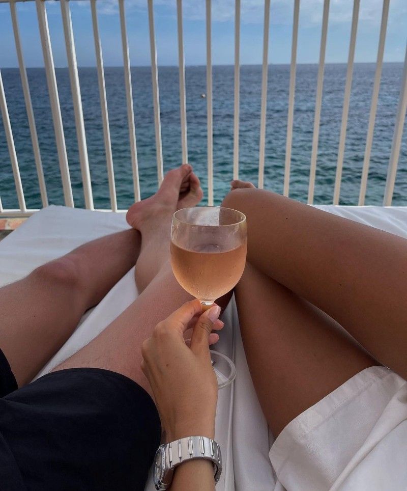 A glass of rosé overlooking the sea