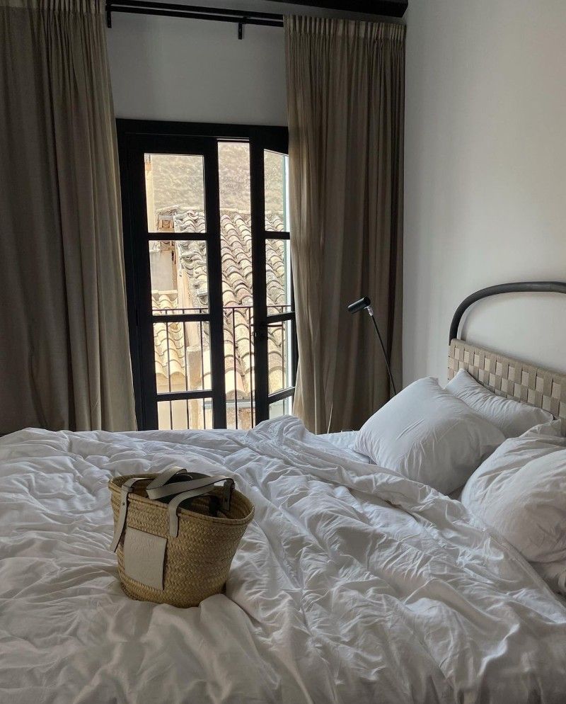 Hotel bed with Loewe basket bag